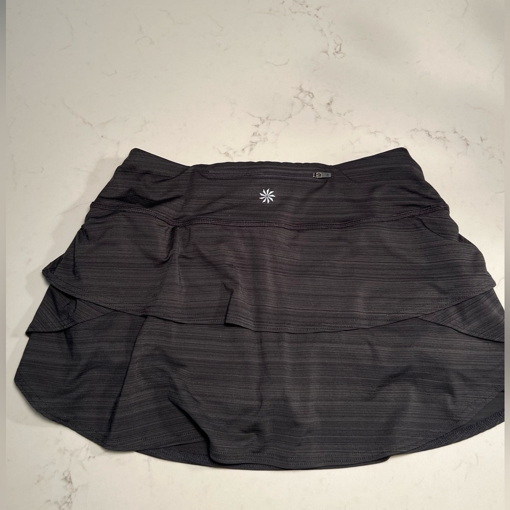 Athleta grey stripe tennis skirt with built-in mesh grip shorts. Ladies sz S